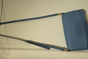 EUC Kate Spade New York Women's Crossbody bag in light blue with a silver chain